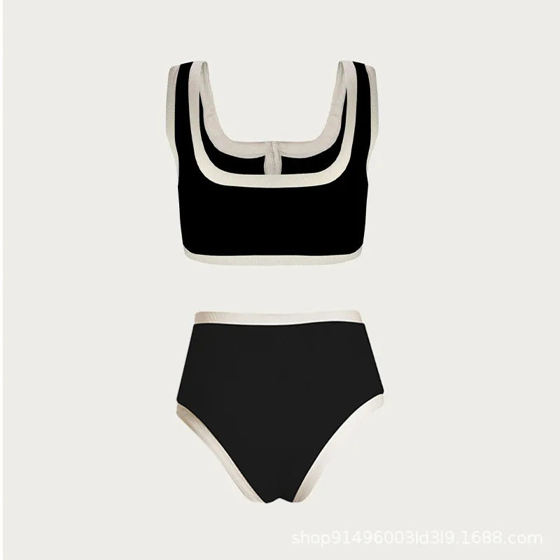 IMIEMIE 2024 new European and American black and white simple ins wind high sense split swimsuit female small fragrance wind than base.